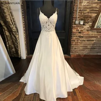 2021 Elegantní Svatební Šaty A-line Nášivky Špagety Popruhy Vestido De Noiva Iluze Živůtek s hlubokým Výstřihem Bílá Svatební Šaty